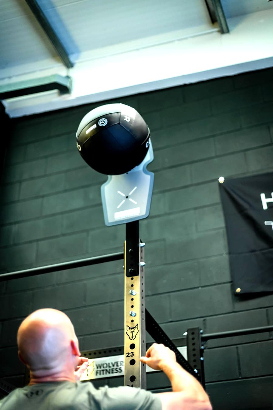 Wall ball being thrown at the HYROX rig target at Effortless Gym Poole
